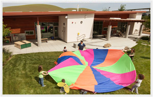 Kids playing with parachute